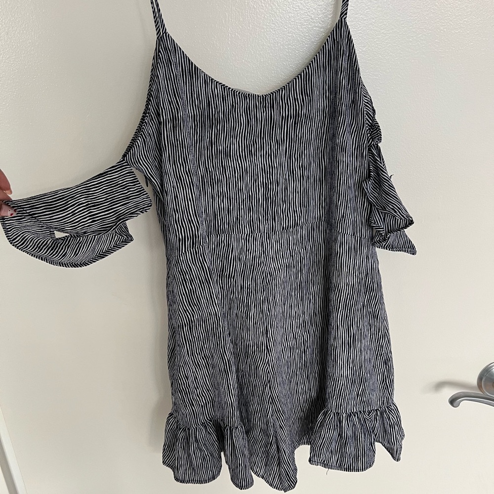 Summer striped romper with off the shoulder sleeves.
